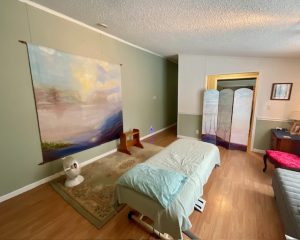Image of lift table, large painting, work bench and heating unit.
